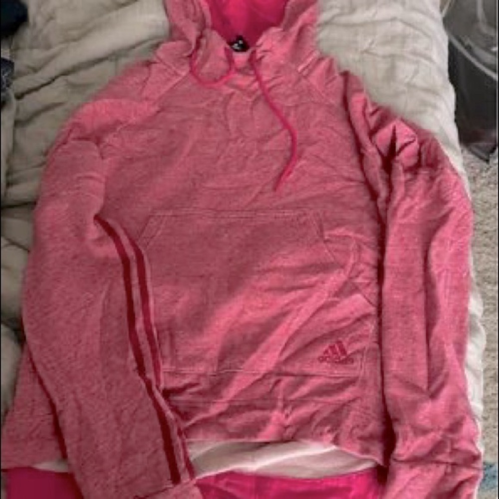 Pink adidas hoodie. Shorter in the front, longer in back.